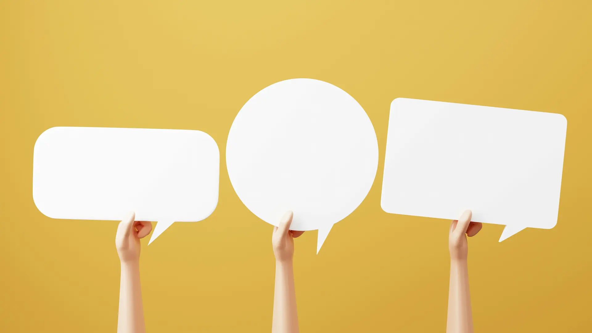 Hands holding speech bubbles symbolizing ESL discussion topics and speaking activities.